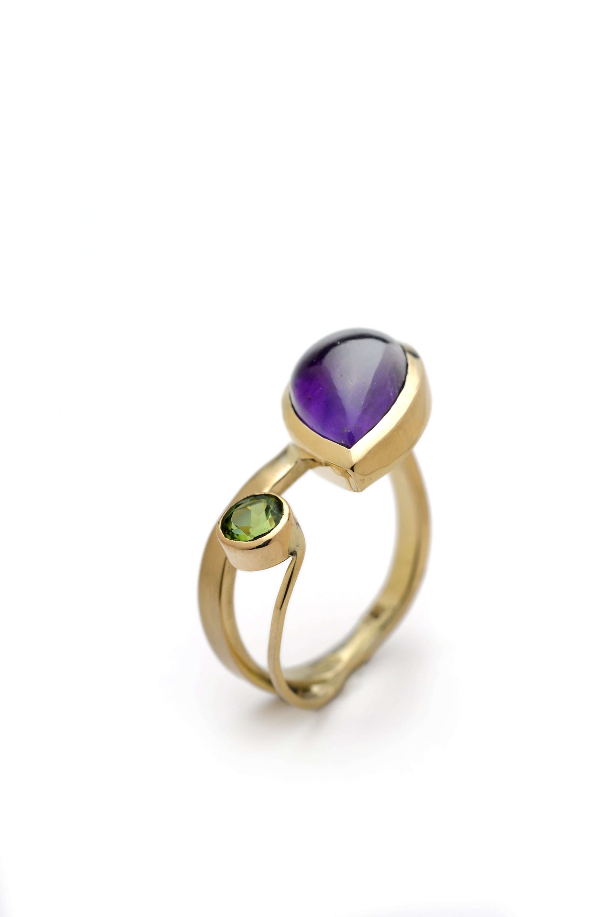 A gold ring with amethyst and peridot, handmade in 18k gold