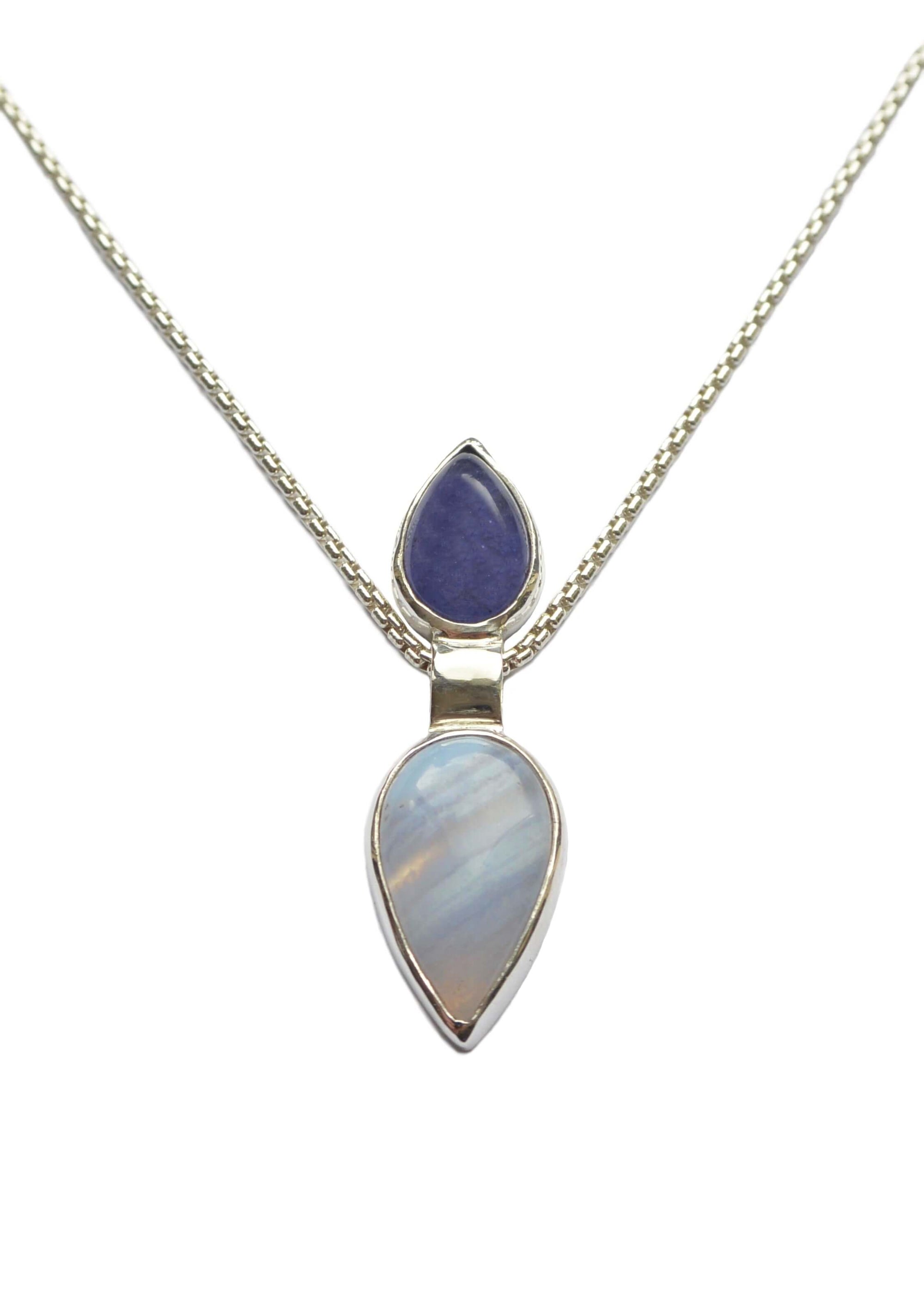 A handmade sterling silver tanzanite pendant with blue agate