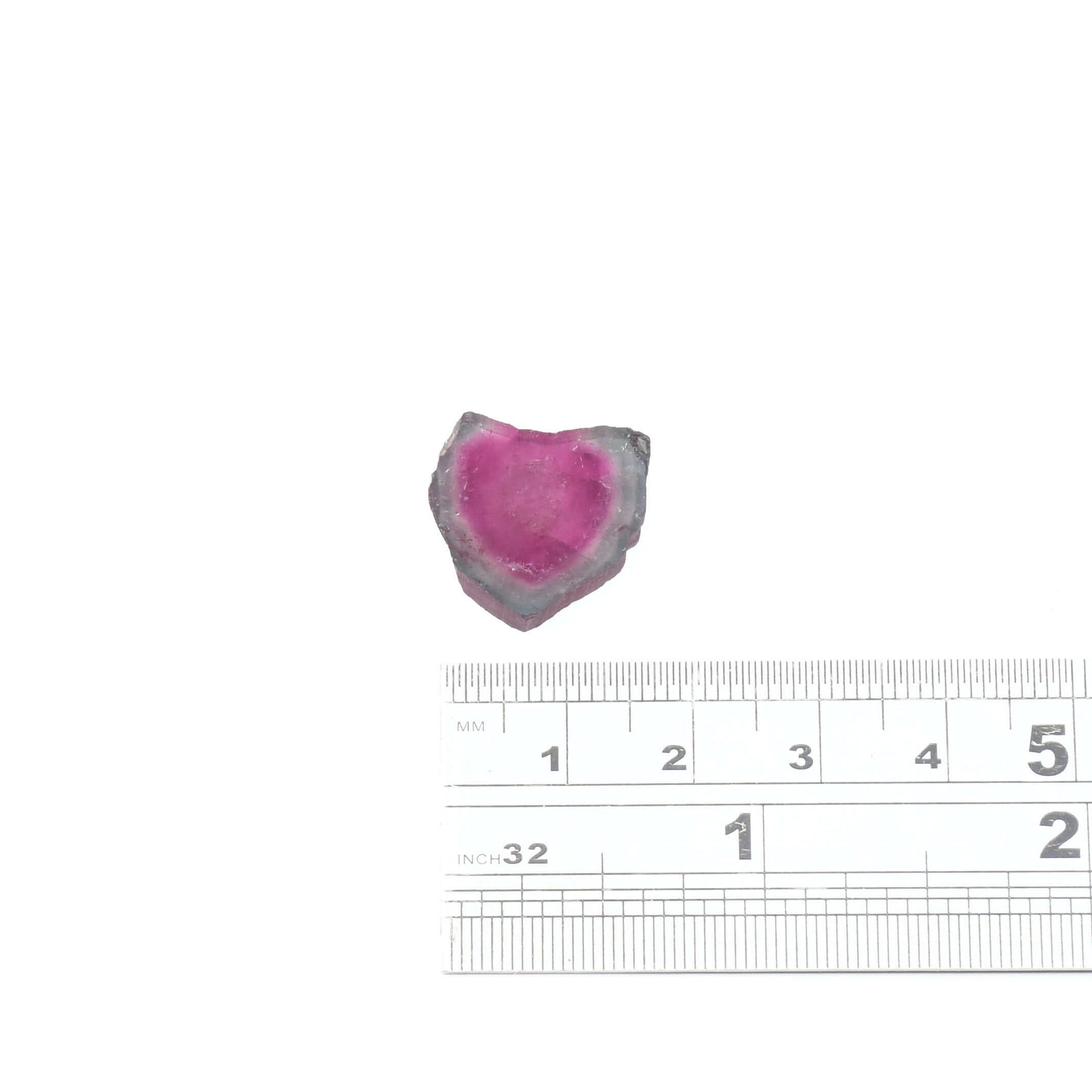 This 11.29ct genuine watermelon tourmaline slice features a large dark pink center and pale blue edge 