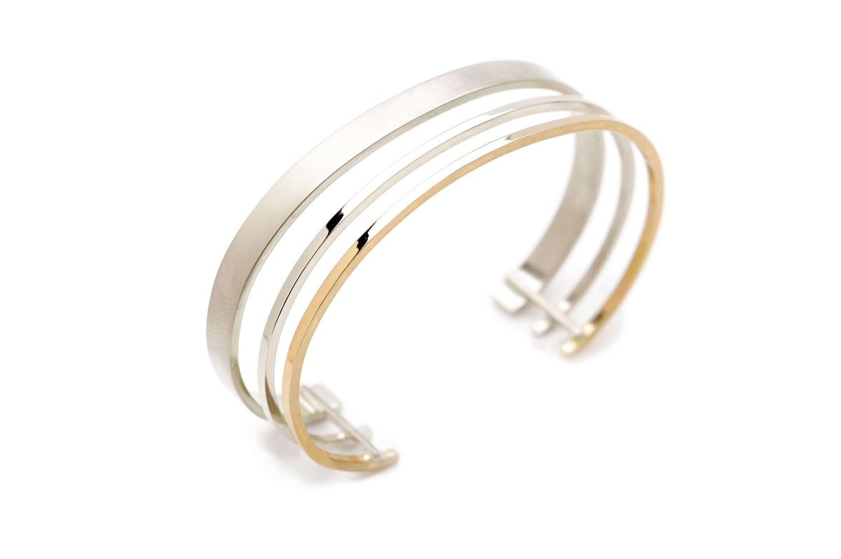 A handmade 14k gold and silver bracelet
