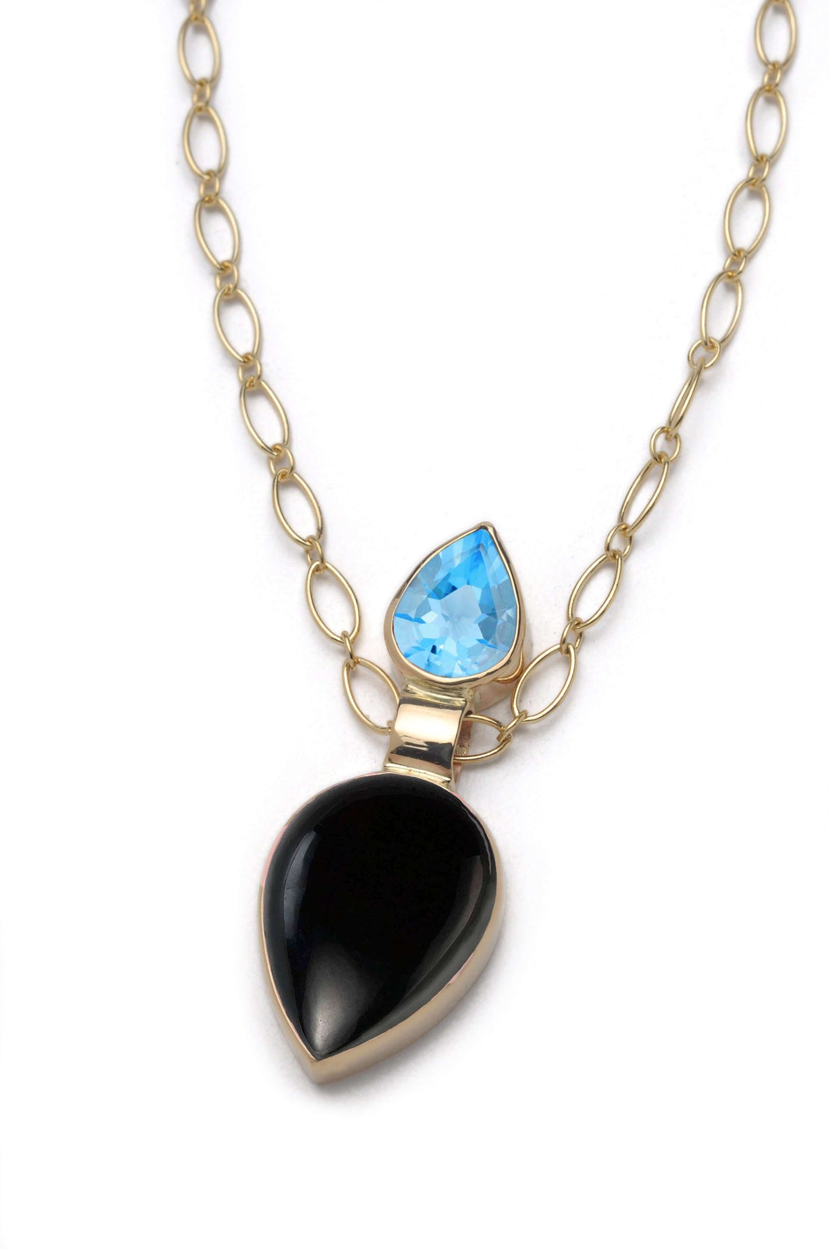 A black onyx necklace with Swiss blue topaz and 14k gold