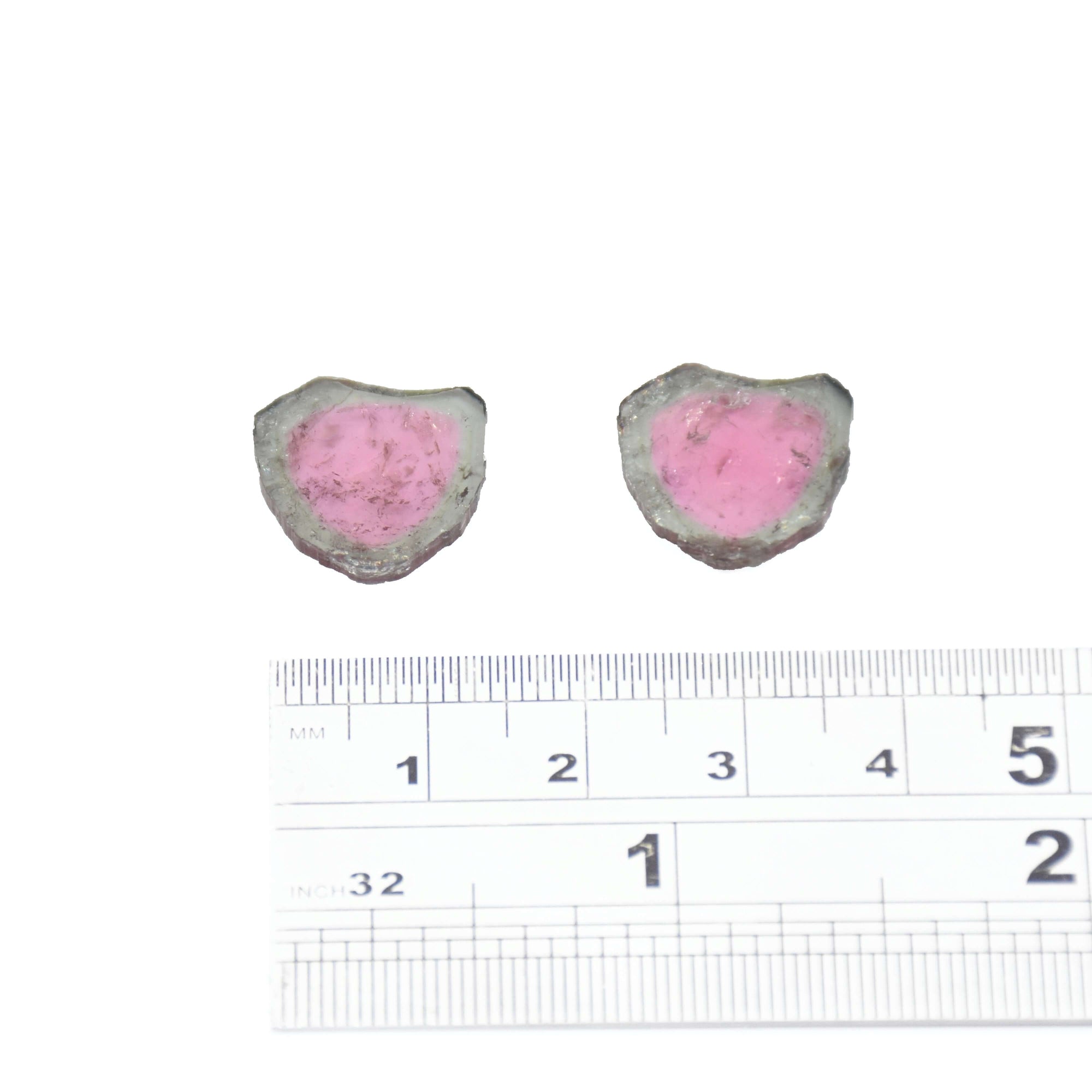 A pair of light teal and light pink loose watermelon tourmaline slices