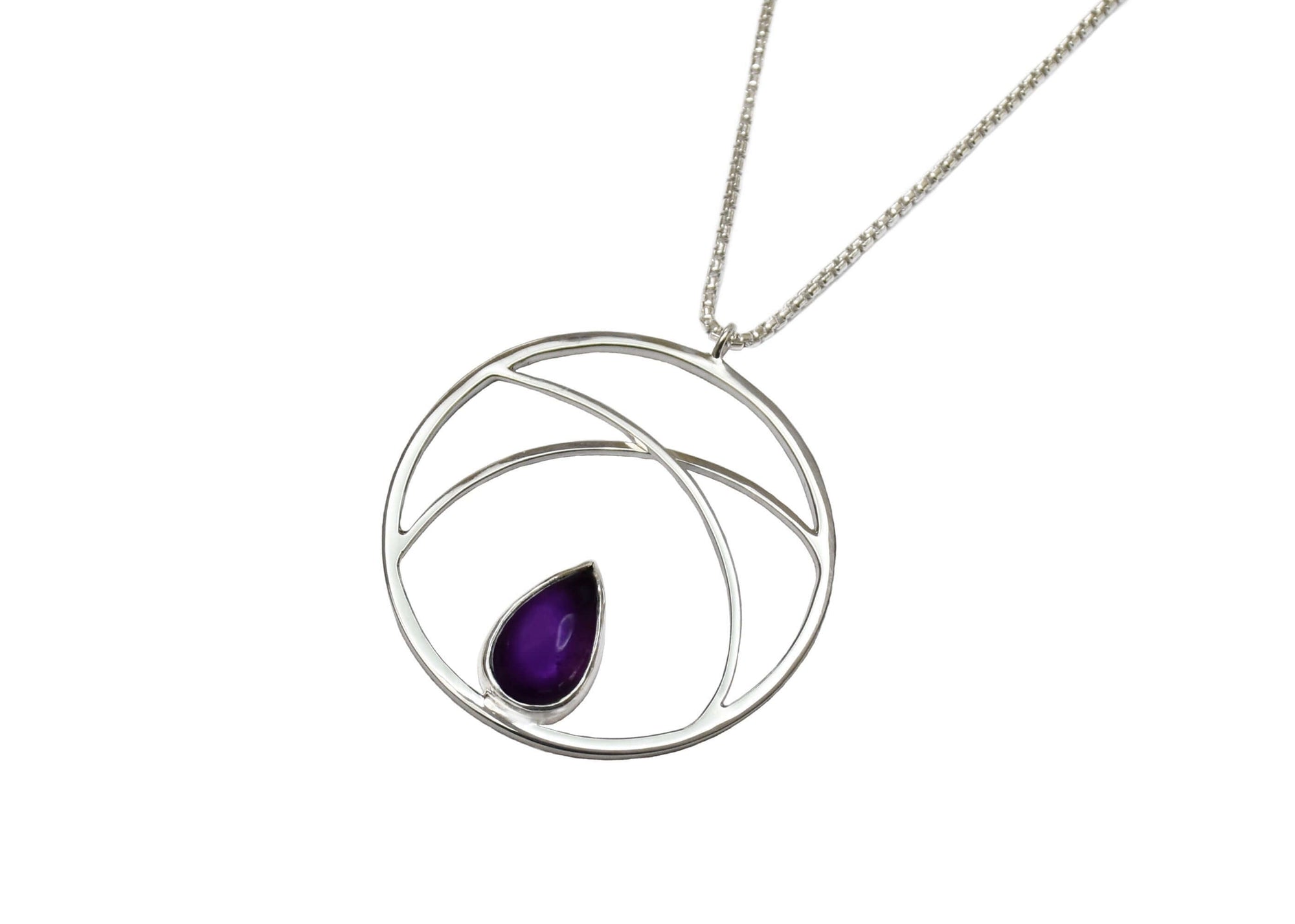 A handmade sterling silver circle pendant necklace with amethyst
