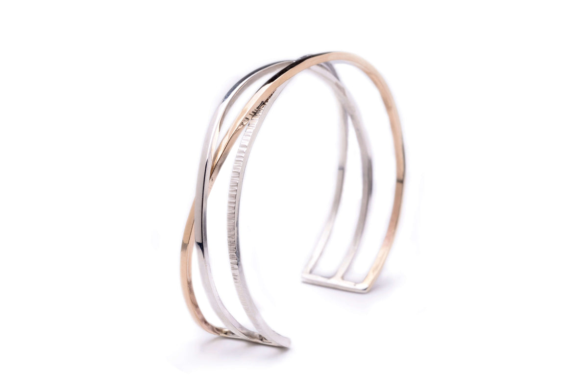 A handmade gold and silver cuff bracelet