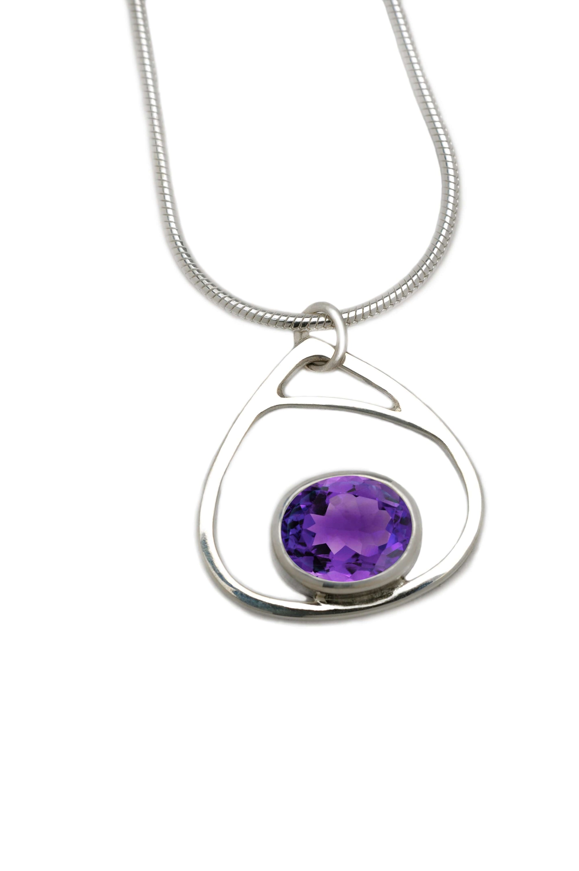 A handmade sterling silver droplet pendant with amethyst gemstone