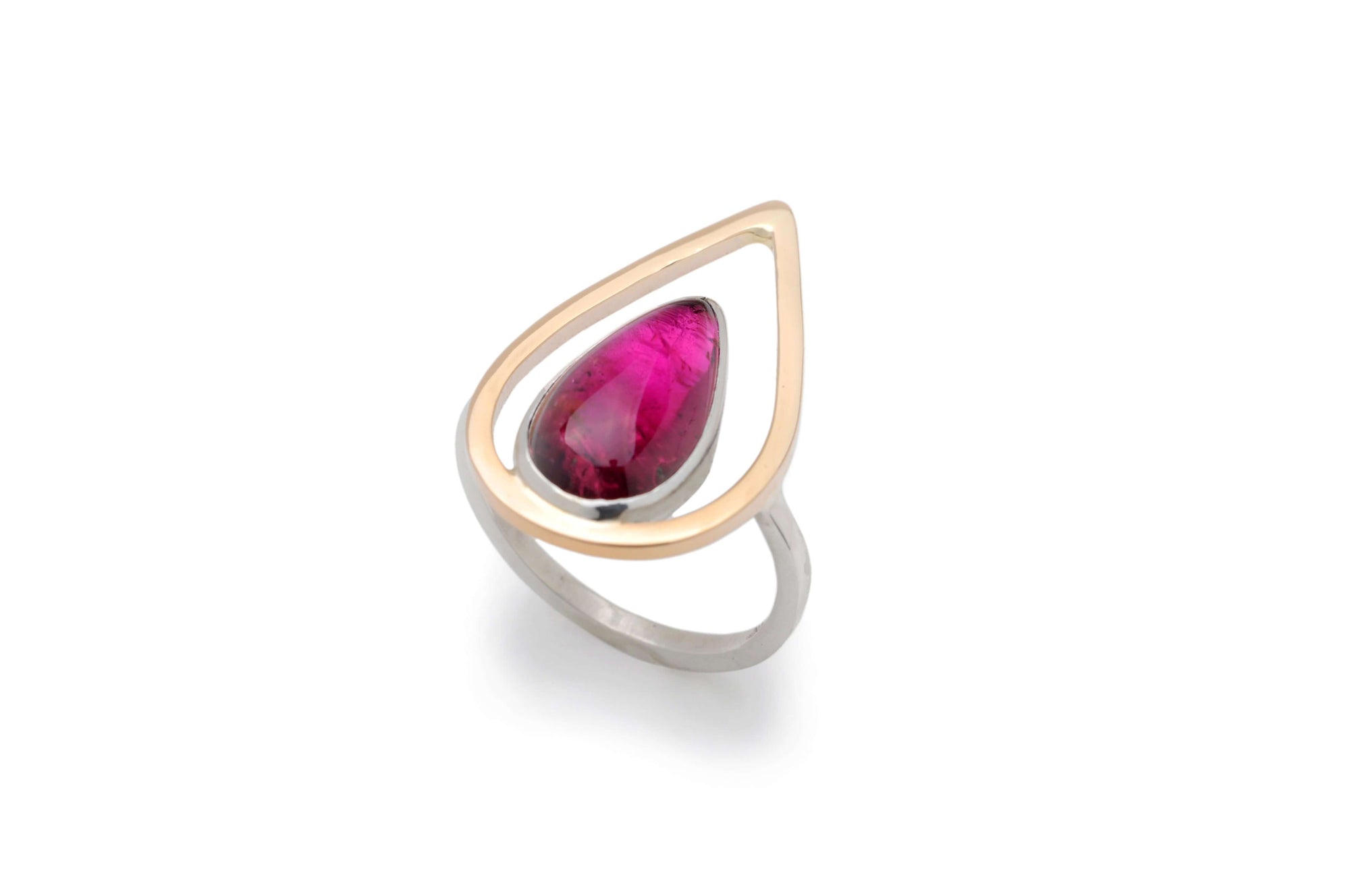 a pink tourmaline ring with gold flame and silver band