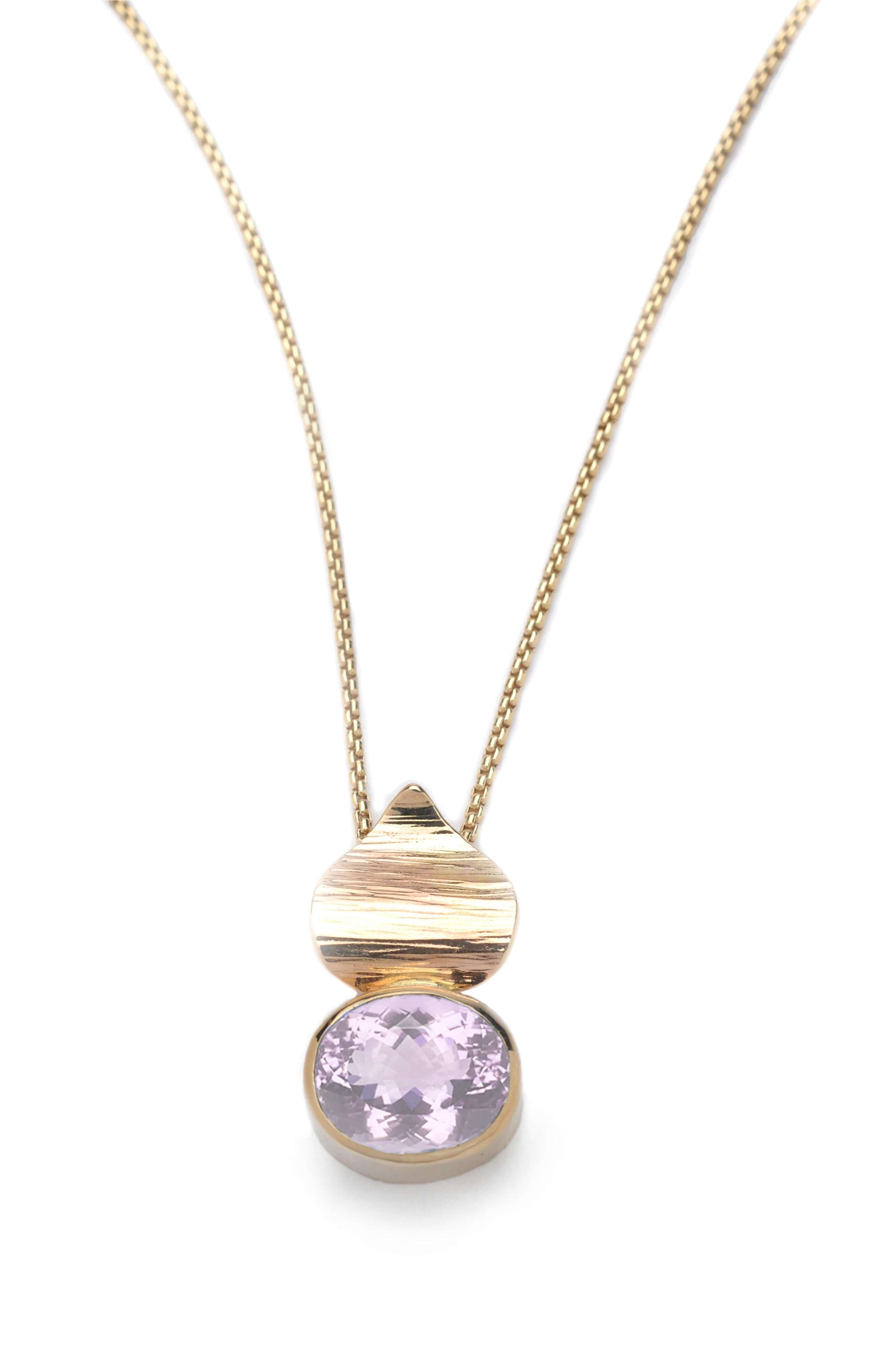 A 14k gold pink amethyst pendant is shown on a gold chain