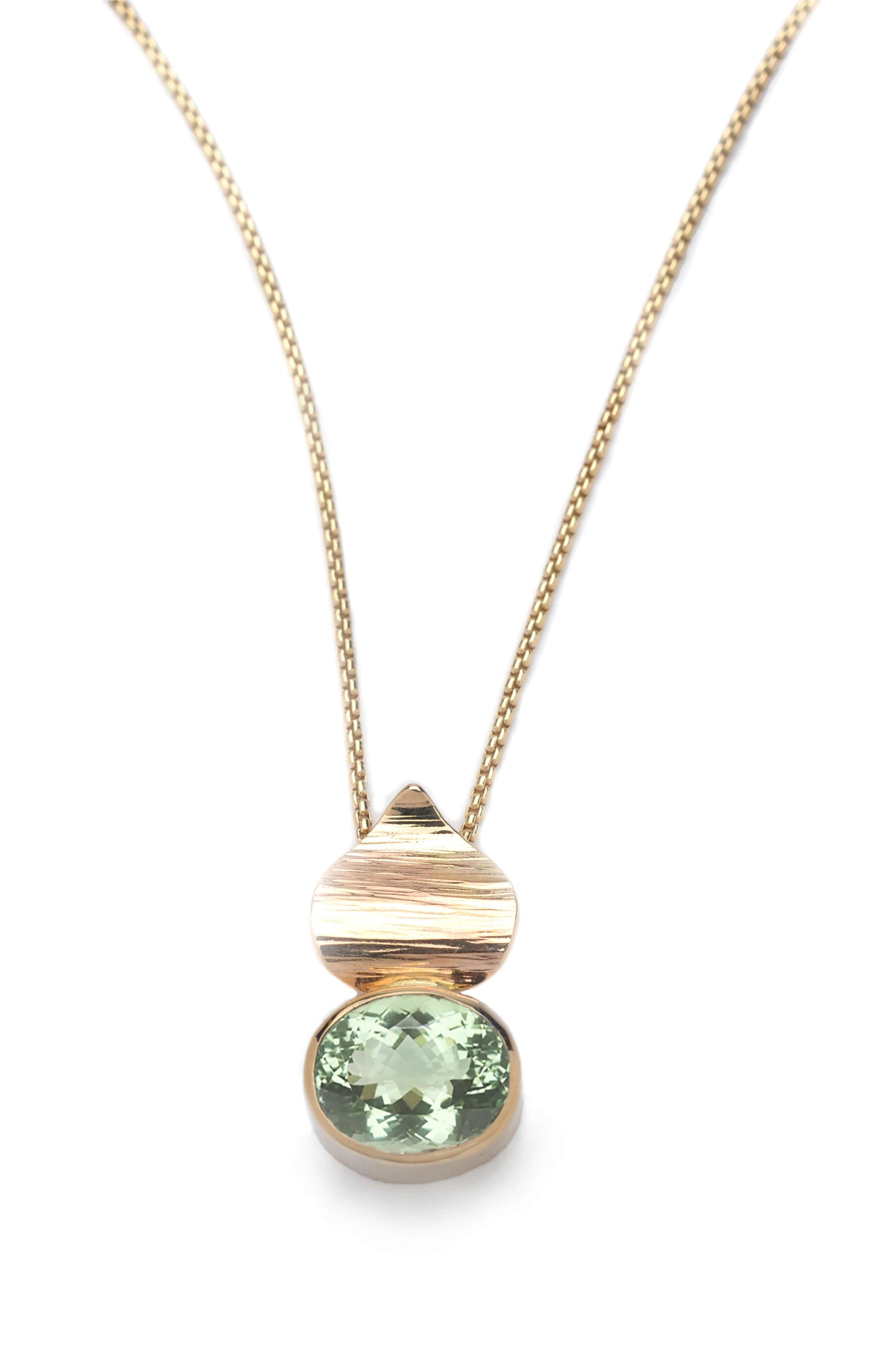 A handmade prasiolite pendant gold with a 14k gold chain