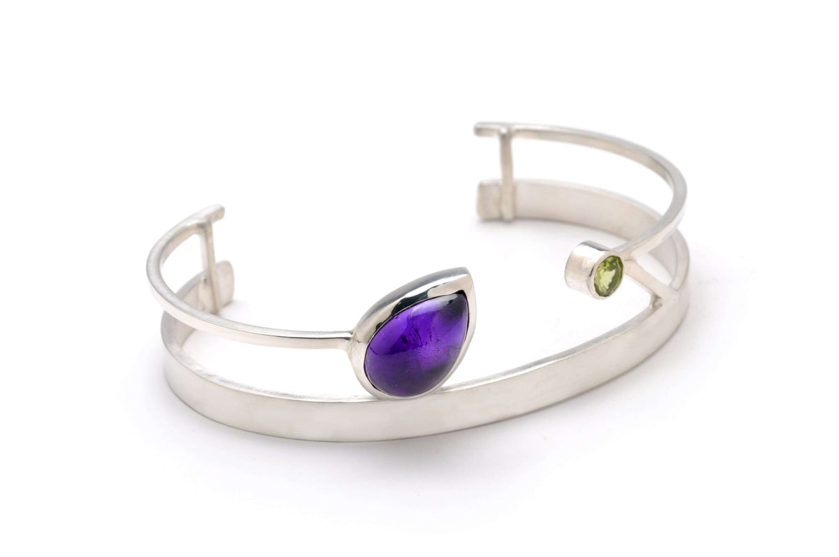 A sterling silver amethyst cuff bracelet with peridot