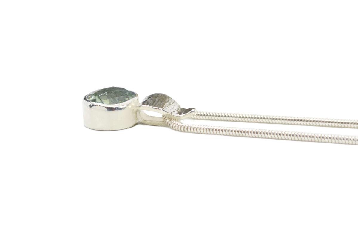 A sterling silver prasiolite pendant necklace is shown from the side