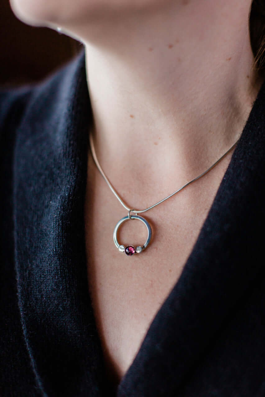 A garnet necklace, sterling silver chain and handmade silver pebbles