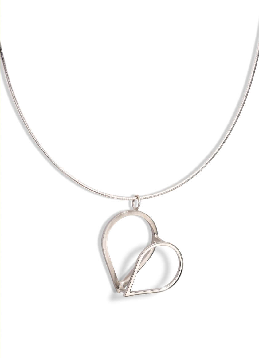 A handmade silver heart necklace on sterling silver chain