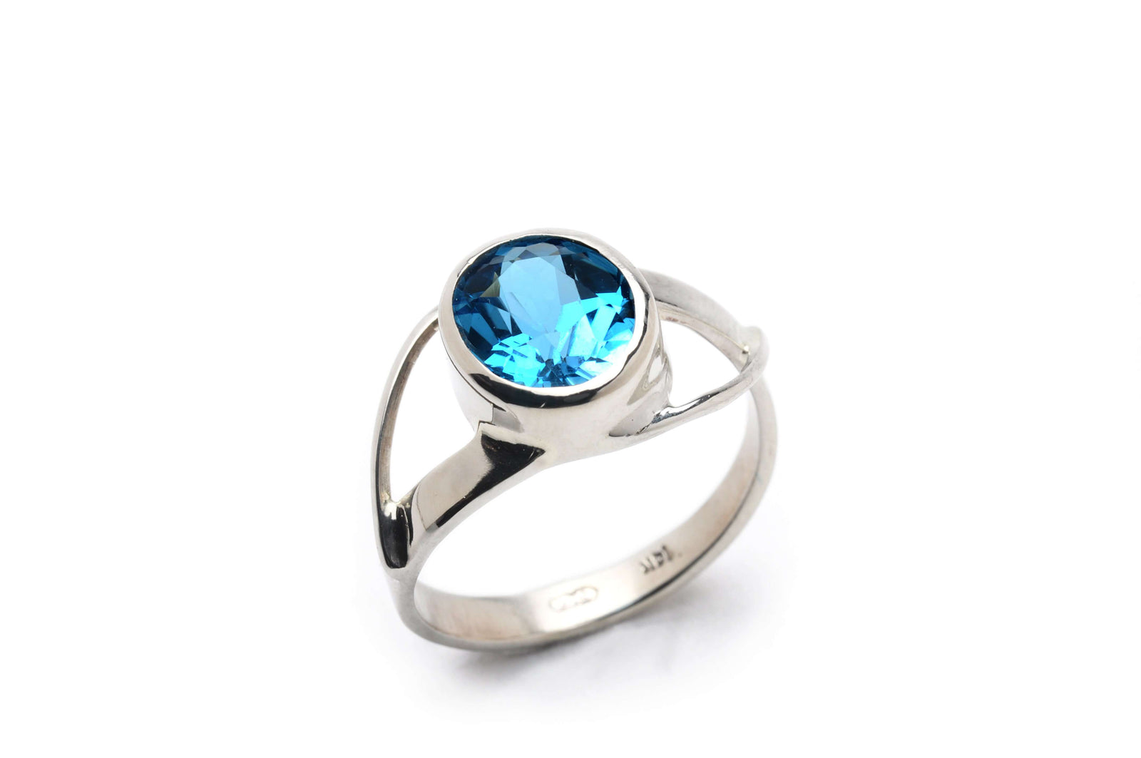 A double twist ring with gemstone and sterling silver band