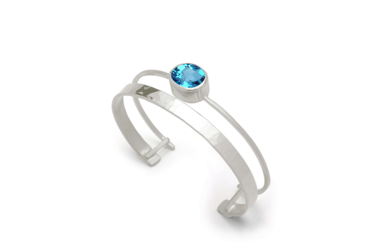 A sterling silver gemstone cuff bracelet with swiss blue topaz