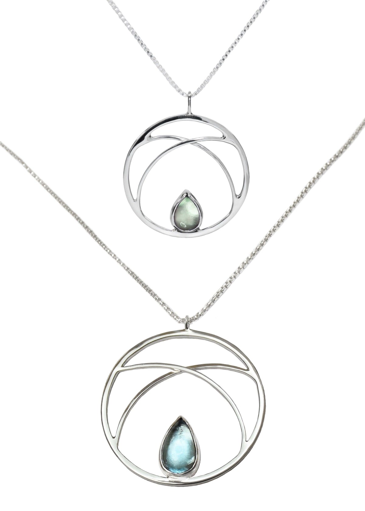 A handmade sterling silver circle pendant necklace is shown in two sizes