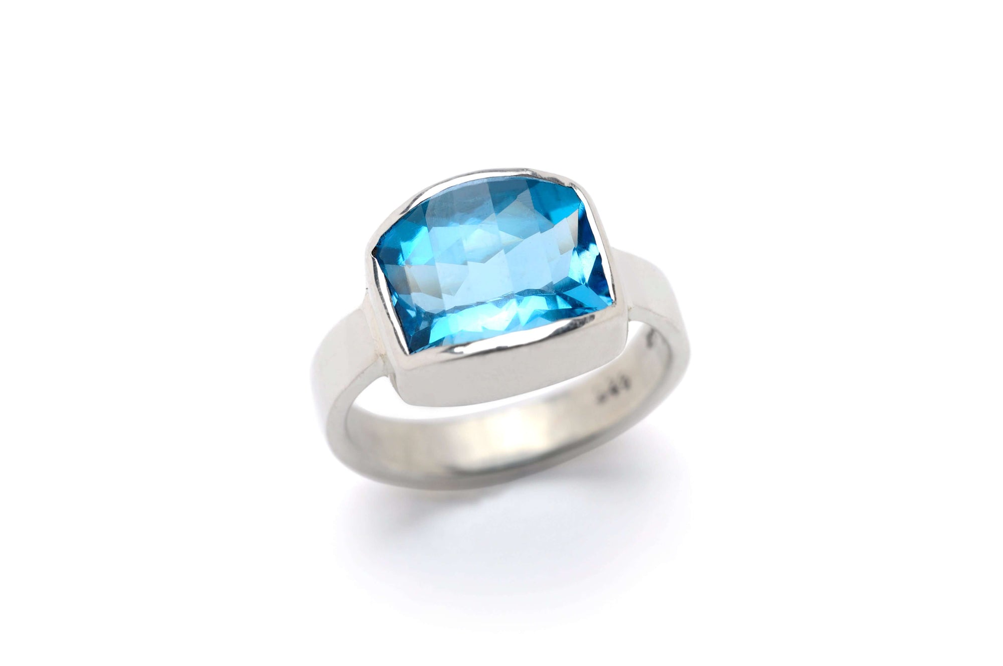 Swiss blue topaz cocktail ring with silver band