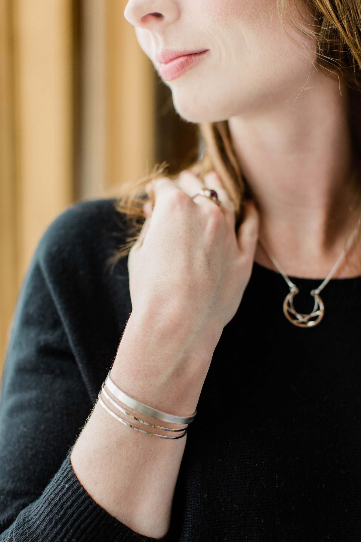 A model wears a sterling silver multi strand cuff bracelet