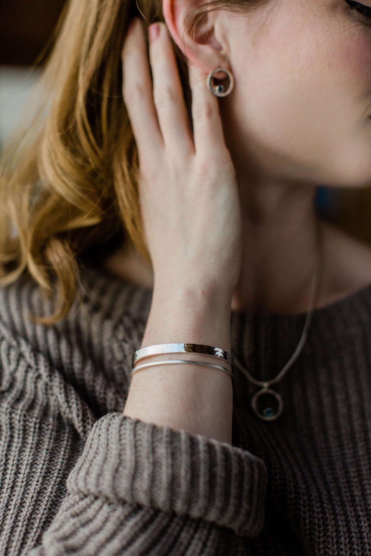 A model wears a handmade sterling silver cuff bracelet women&#39;s jewelry gift