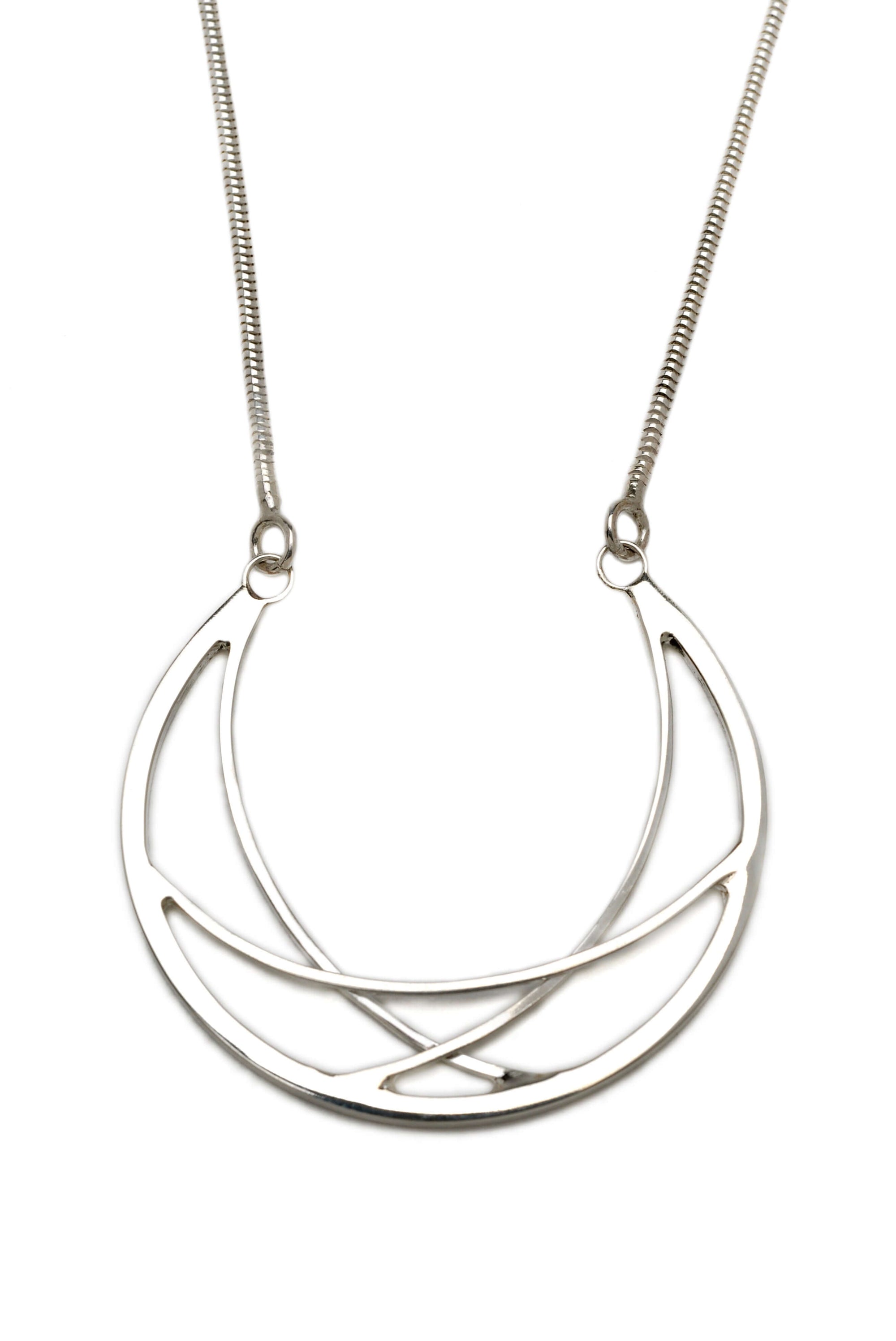 A large handmade sterling silver crescent necklace on a silver chain