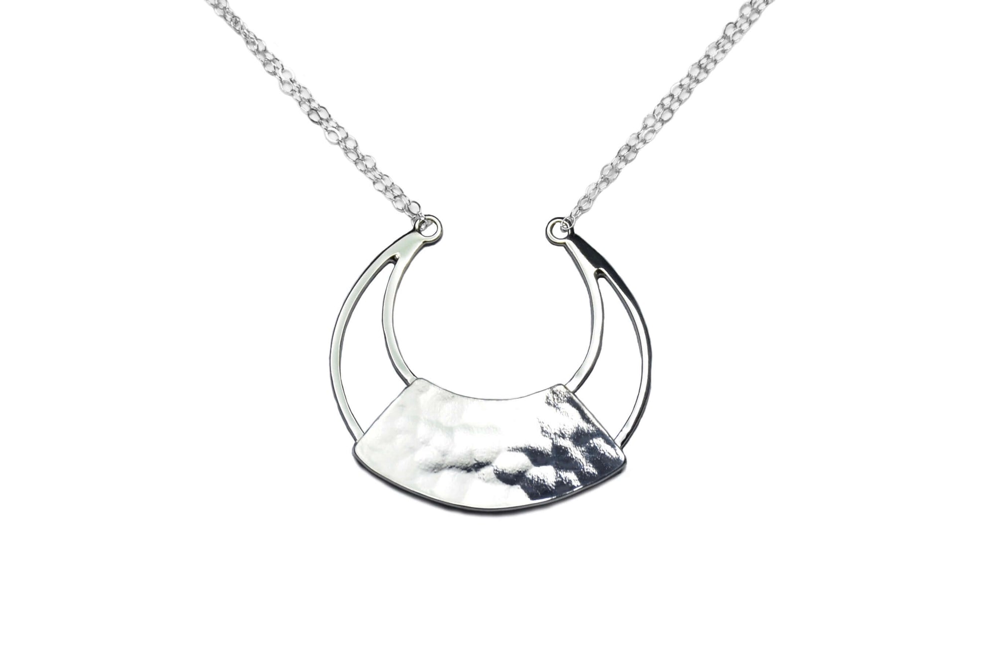 A handmade sterling silver torc necklace on a silver chain