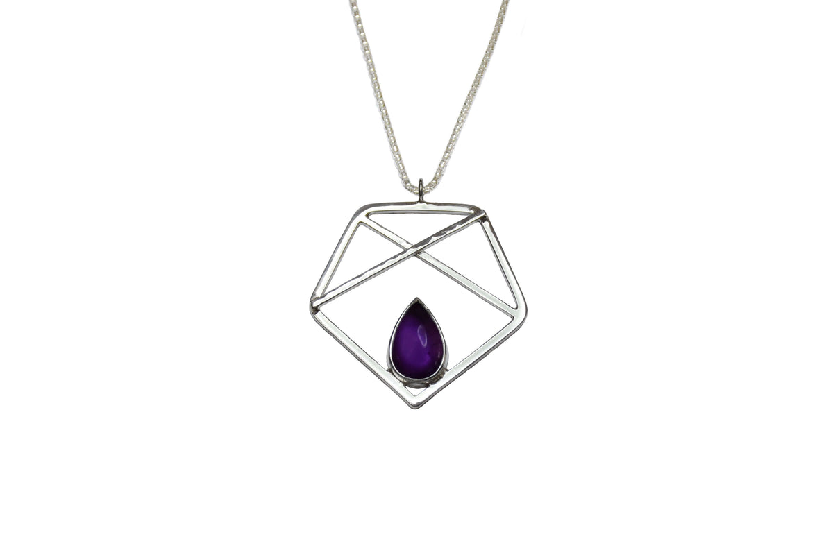 A handmade sterling silver pentagon pendant with amethyst
