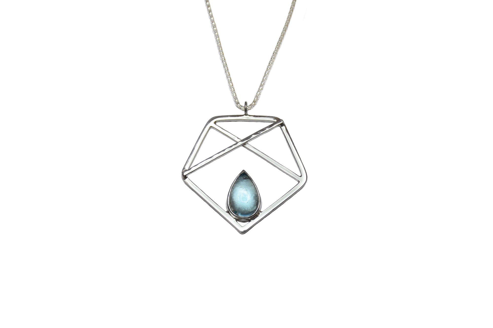 A handmade sterling silver pentagon pendant with sky blue topaz