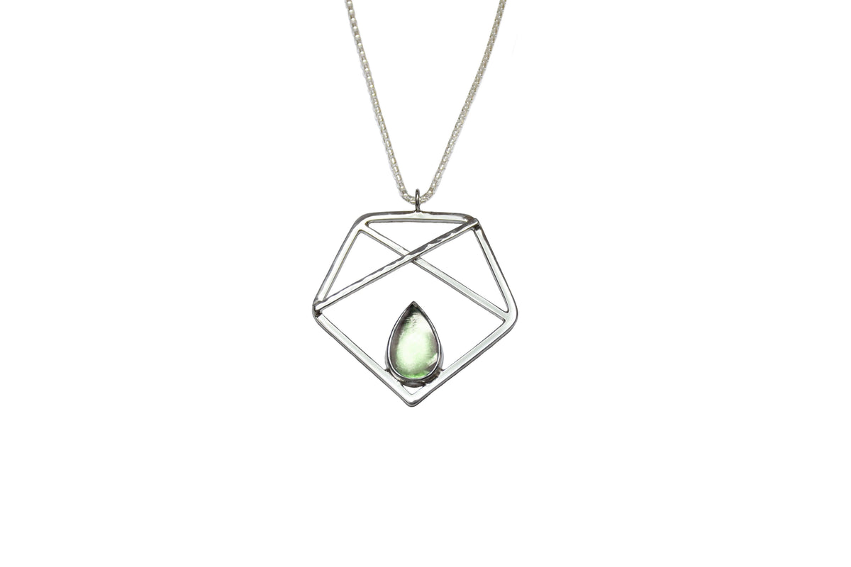 A handmade sterling silver pentagon pendant with green prasiolite