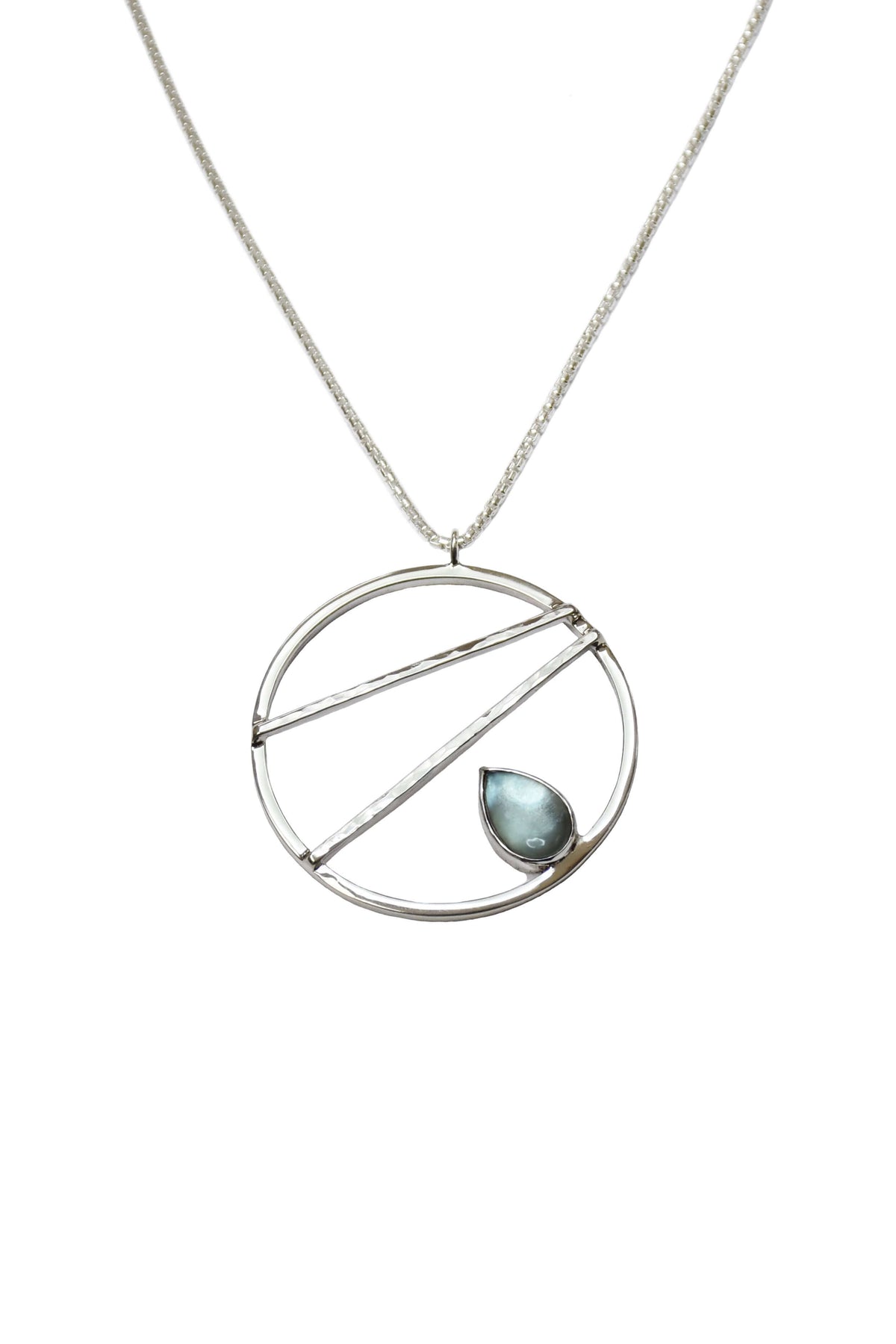 A handmade sterling silver crossbar necklace with sky blue topaz