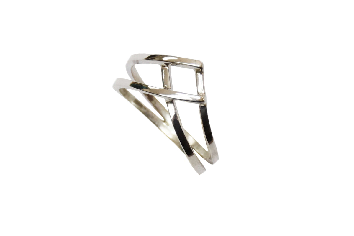 A woven silver ring is shown on an angle